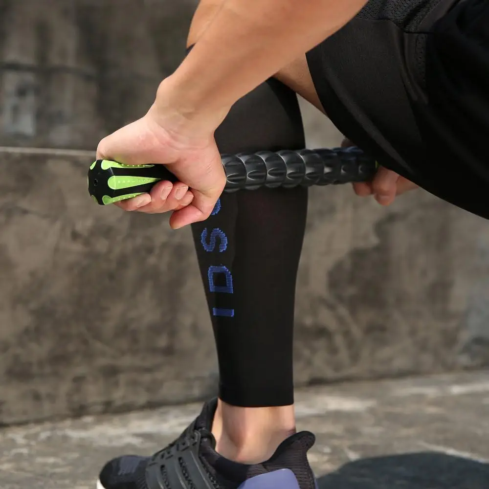 Muscle Roller Stick for Athletes – Handheld Body Massage Roller - in use